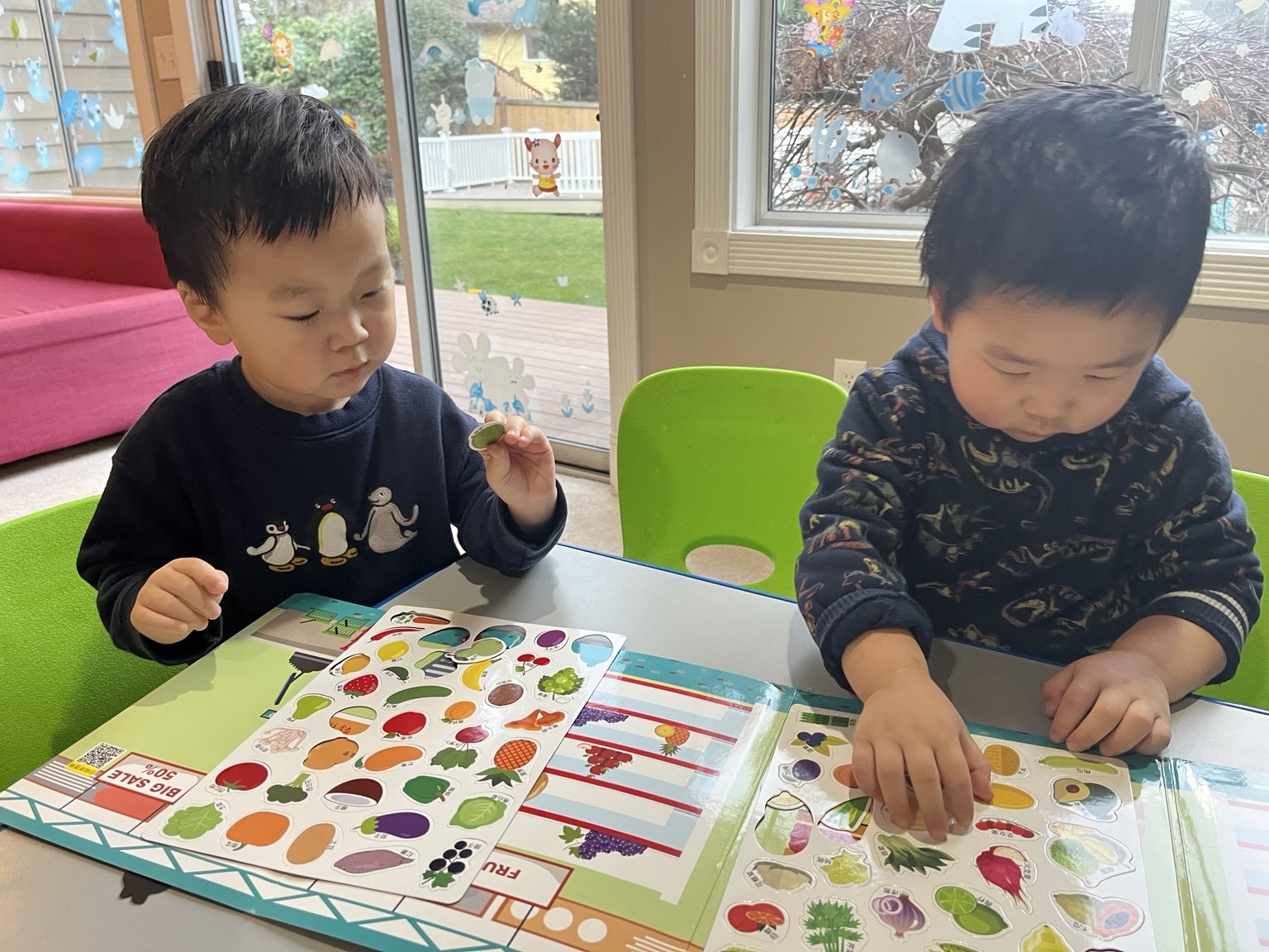 Two children working together on a hands-on classroom activity